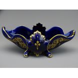 FRANCOIS I CRESTED FOUR FOOTED BOWL, cobalt ground with hand painted gilt decoration on four feet,