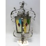 VINTAGE STYLE WROUGHT IRON & COLOURED GLASS HALL LANTERN, 66cms H