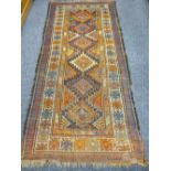 EASTERN WOOLLEN CARPET with central zig zag diamond pattern and multi-bordered edge (faded and