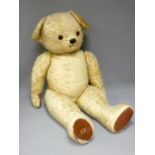 LARGE MOHAIR TEDDY BEAR with jointed limbs and rexine pads (play worn condition), 106cms L