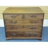 GEORGIAN MAHOGANY CHEST of two short over three long drawers, oak lined with brass swan neck handles