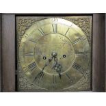 THOMAS RAMSBOTTOM BRASS DIAL CARVED OAK LONGCASE CLOCK, 12in dial set with Roman numerals and chased