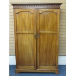 CIRCA 1910 MAHOGANY TWO DOOR WARDROBE with Venetian type arch carving to the cornice over two twin