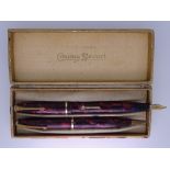 CONWAY STEWART - Vintage (1950s) Red Marble Conway Stewart 550 "Dinkie" fountain pen and pencil set,