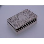 SILVER LIDDED PILL OR MATCHBOX, oblong with floral scrolled lid and scrolled base with centre