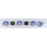 9CT GOLD BLACK ONYX DIAMOND & HARDSTONE BRACELET, the hardstone carved as four flower heads