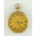 9CT YELLOW GOLD LADIES FOB WATCH, scroll and foliate engraved with initials. 27.9gms