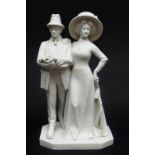 GERMAN WHITE GLAZED PORCELAIN FIGURAL GROUP OF AN EDWARDIAN LADY & GENTLEMAN standing in formal