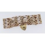 9CT GOLD SEVEN BAR GATE BRACELET, 16.1gms