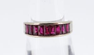 18CT WHITE GOLD NINE-STONE RUBY HALF ETERNITY RING, 3.6gms in box