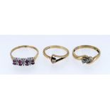 THREE 9CT GOLD LADIES DRESS RINGS OF VARIOUs DESIGNS, set with small diamonds, 6.6gms overall (3)