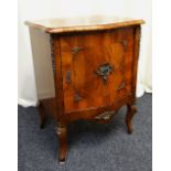 FRENCH-STYLE SERPENTINE WALNUT CUPBOARD with interior shelf and gilt metal mounts