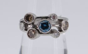 PLATINUM DIAMOND SEVEN-STONE RING (one blue, three brown, three white), 6.8gms