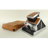 VINTAGE POLAROID SX-70 LAND CAMERA with tan leather facings and leather carry case