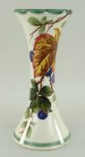 LLANELLY POTTERY WAISTED VASE PAINTED WITH BLACKBERRIES on branches with leaves, 21cms high