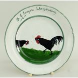 LLANELLY POTTERY TEA PLATE PAINTED WITH TWO STRUTTING BLACK COCKS inscribed to border S J James,