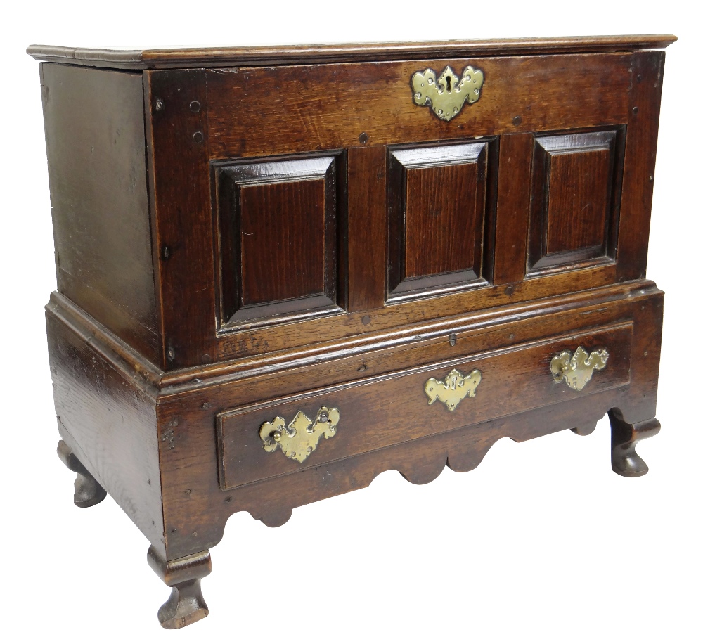 GEORGE II OAK COFFER BACH detachable lid with moulded edge, above triple fielded panel front over