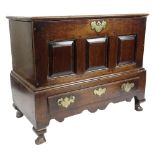 GEORGE II OAK COFFER BACH detachable lid with moulded edge, above triple fielded panel front over
