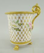SWANSEA PORCELAIN CABINET CUP of cylindrical shape with everted rim and raised on three paw feet,