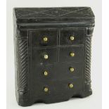 NINETEENTH CENTURY CARVED SLATE DOORSTOP MODELLED AS A BUREAU with twist quarter column and fixed