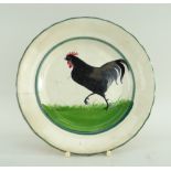 LLANELLY POTTERY SIDE-PLATE PAINTED WITH STRUTTING BLACK COCK on sponged grass within two green