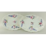 PAIR OF NANTGARW PORCELAIN OVAL CRUCIFORM DISHES both painted with groups of blue flowers and pink