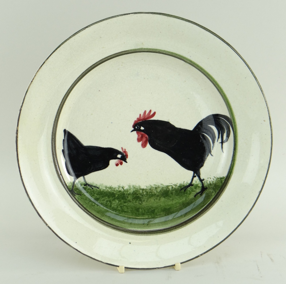 RARE LLANELLY POTTERY DINNER PLATE PAINTED WITH TWO STRUTTING BLACK COCKS on sponged green grass,