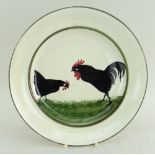 RARE LLANELLY POTTERY DINNER PLATE PAINTED WITH TWO STRUTTING BLACK COCKS on sponged green grass,