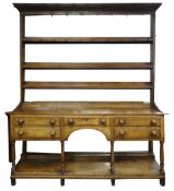 EARLY NINETEENTH CENTURY CILYCWM OAK HIGH DRESSER, CARMARTHENSHIRE, open delft rack with hand