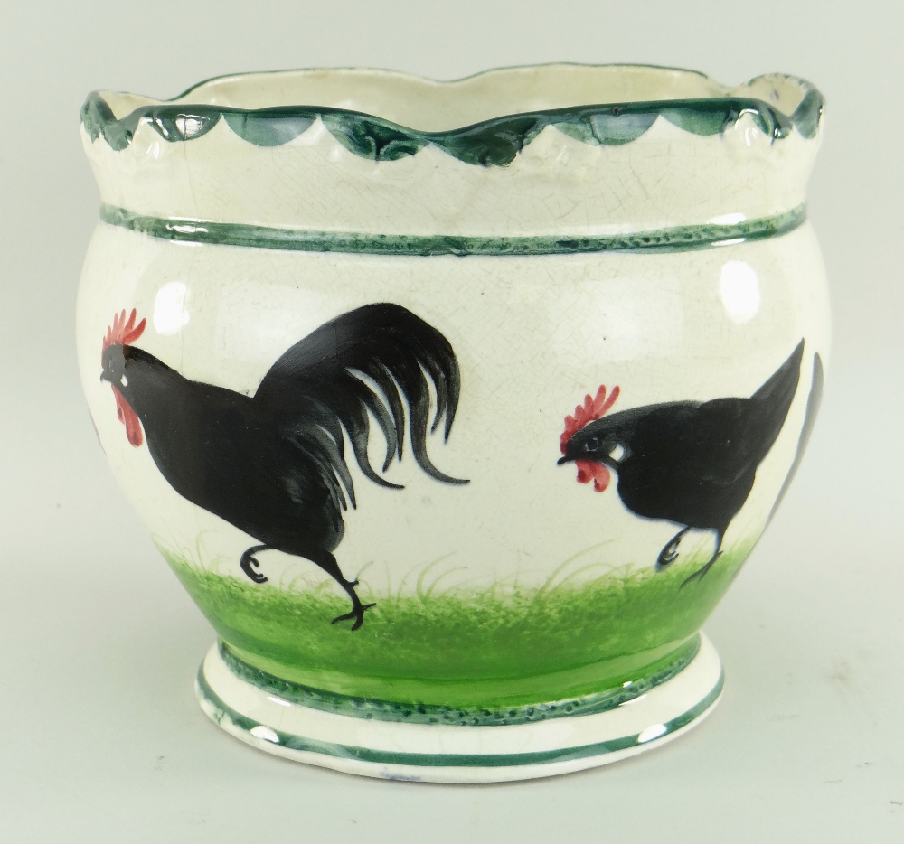 RARE LLANELLY POTTERY JARDINIERE painted with seven strutting black cocks on sponged grass, lobed