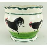 RARE LLANELLY POTTERY JARDINIERE painted with seven strutting black cocks on sponged grass, lobed