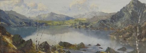 CHARLES WYATT WARREN oil on board - Eryri with lake on bright day, signed, 28 x 74cms