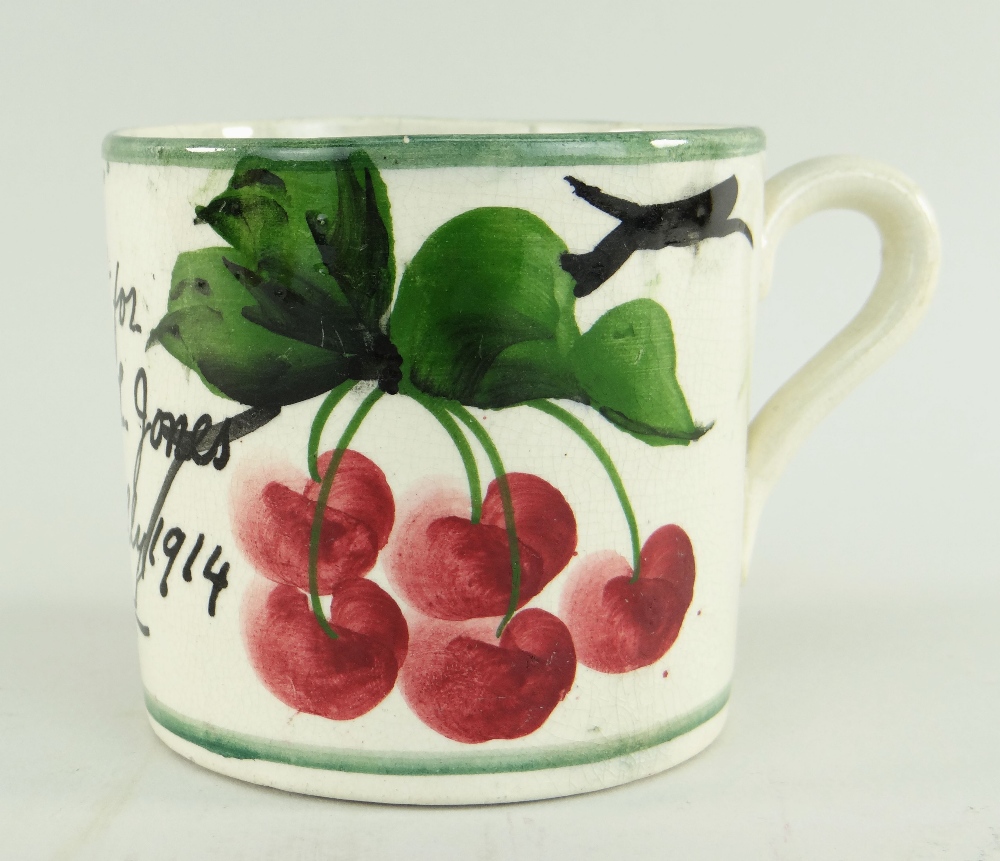 RARE LLANELLY POTTERY MUG PAINTED WITH CHERRIES ON A BRANCH the body inscribed 'A present for