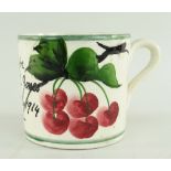 RARE LLANELLY POTTERY MUG PAINTED WITH CHERRIES ON A BRANCH the body inscribed 'A present for