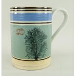 A LLANELLY POTTERY MOCHA WARE MEASURED PINT TANKARD decorated with sponged trees to coloured
