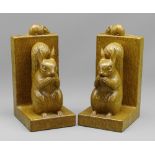 ROBERT 'MOUSEMAN' THOMPSON OF KILBURN: A PAIR OF CARVED OAK SQUIRREL BOOKENDS, each modelled with