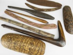 COLLECTION OF ABORIGINAL ARTEFACTS comprising two pyrographed coolamons, two boomerangs, leangle