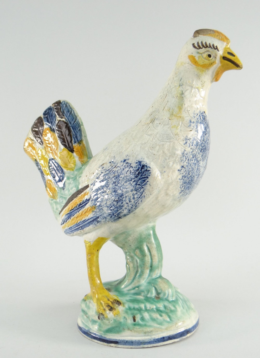 RARE PRATTWARE POTTERY FIGURE OF A HEN, CIRCA 1790/1810, crisply modeled and incised, brightly