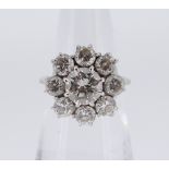 WHITE METAL NINE-STONE DIAMOND CLUSTER RING, the central stone (1.0ct approx.) surrounded by eight