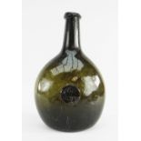 RARE 18TH CENTURY SEALED WINE BOTTLE, DATED 1777, of 'stretched' bladder form in olive green