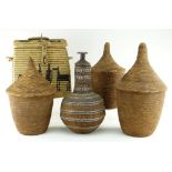 THREE AFRICAN BASKETS WITH CONICAL COVERS, possibly Tutsi, tallest 44cms, an Ethiopian wired