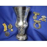 MILITARY & WELSH INTEREST silver waisted vase raised on circular pedestal base with flared rim.