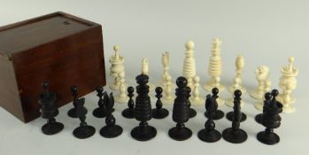 A MID-19TH CENTURY ENGLISH IVORY CHESS SET, stained black and natural, turned banded form on