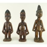 PAIR OF YORUBA MALE & FEMALE IBEJIS, Nigeria, 24cms and another, 30cms (3)