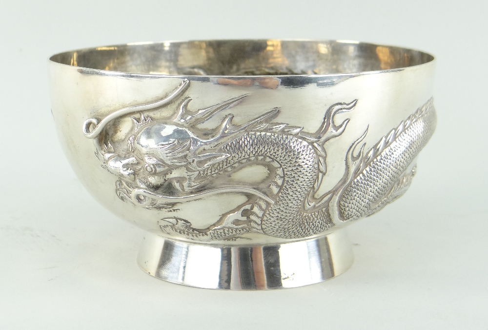 CHINESE SILVER BOWL BY CHEUNG SHING, c.1920, repousse decorated with a single four-clawed dragon