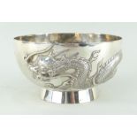 CHINESE SILVER BOWL BY CHEUNG SHING, c.1920, repousse decorated with a single four-clawed dragon