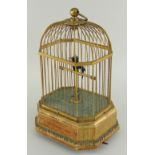 A SINGING BIRD AUTOMATON, FRENCH EARLY 20TH CENTURY green feathered hummingbird type with beak, head