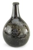 RARE 18TH CENTURY SEALED WINE BOTTLE, DATED 1775, of 'stretched' bladder form in olive green