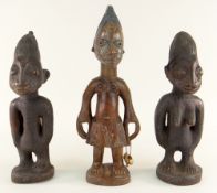 YORUBA MALE IBEJI, Nigeria, 29.5cms and a pair similar, 26cms (3)