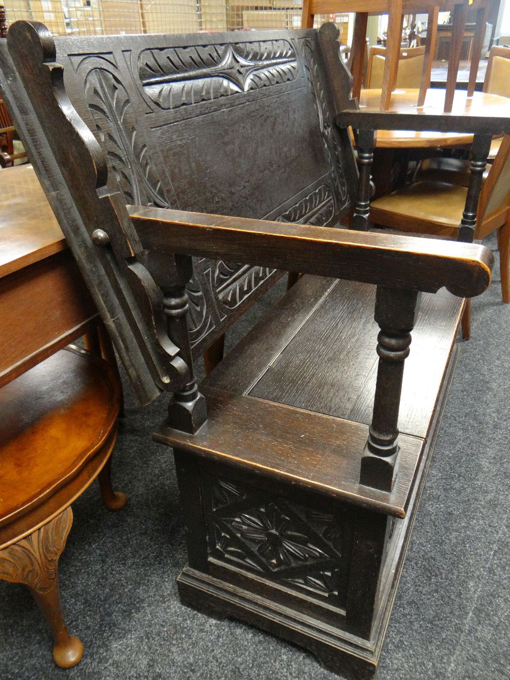 17TH CENTURY-STYLE CARVED OAK MONKS BENCH carved top and hinged box base, 122cms wide - Image 2 of 4